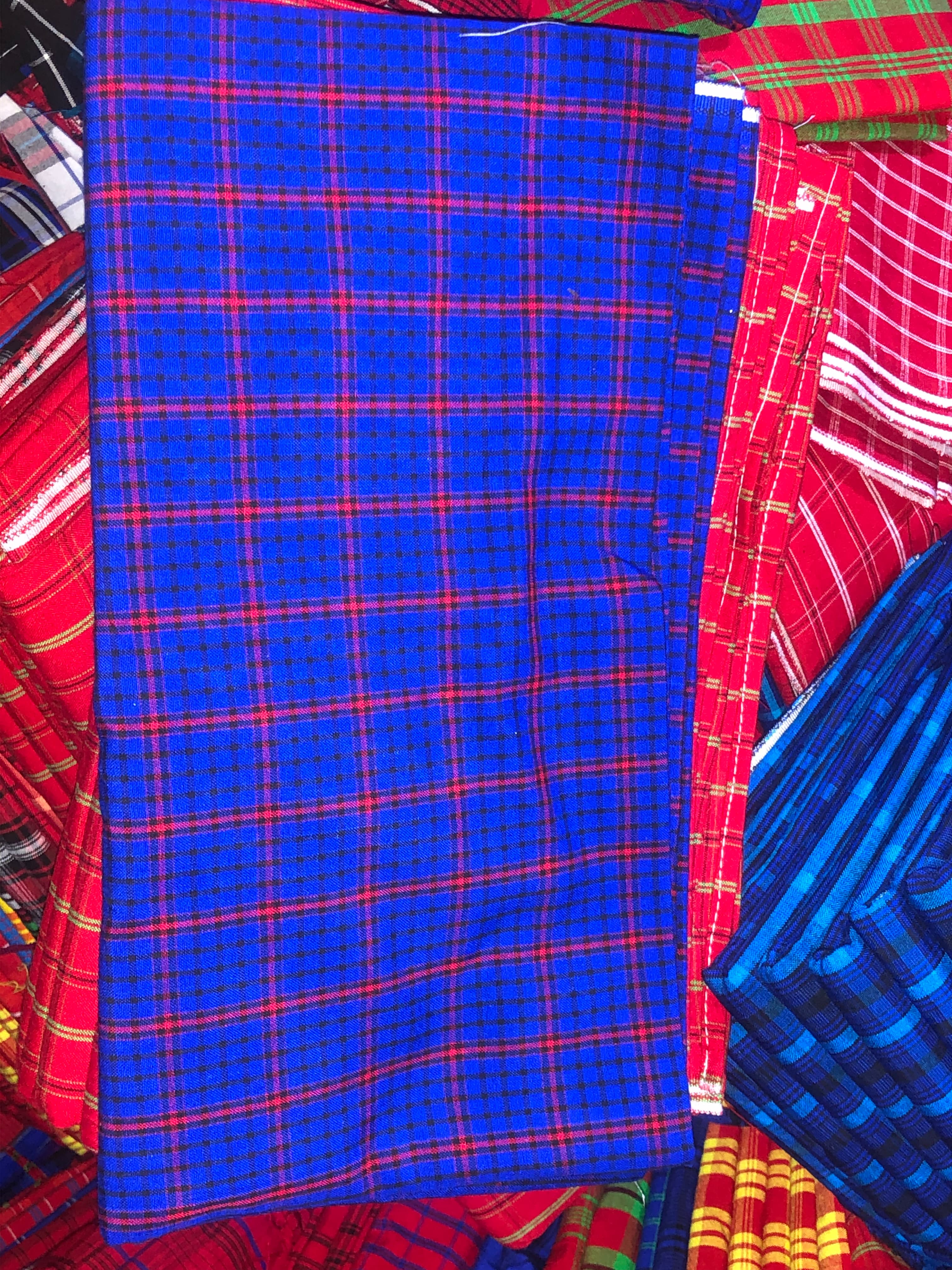 Checked shuka textiles on display in Arusha; a fabric reference